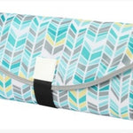 Foldable picnic blanket with chevron pattern on a white background