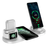 Multi-device charging station with smartphone, smartwatch, and earbuds on a white background