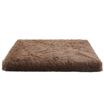 Brown fluffy pet bed on a white background