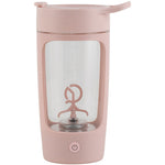 Pink travel mug with clear lid on a white background