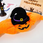 Halloween-themed orange plush toy with a black witch hat on a white background