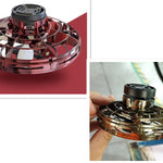 Two images of a handheld fidget spinner with red and gold colors.