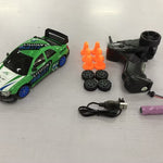 Toy car with remote control, battery, and cones on a white background
