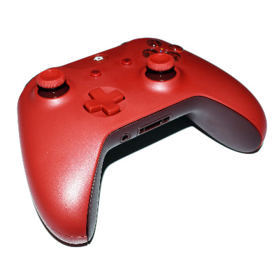 Red gaming controller on a white background