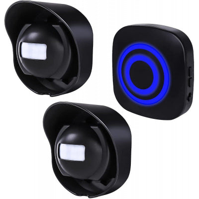 Two black spherical devices and a square device with blue light on a white background