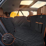Car interior with a black and orange quilted bench cover, showing detailed texture.