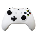 White gaming controller with black buttons on a white background