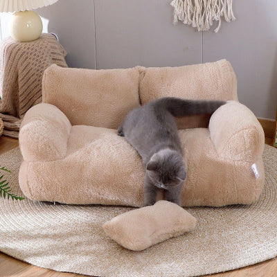 Beige pet bed with a gray cat on a wooden floor