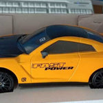 Yellow toy car with 'Fast Power' text on a white surface