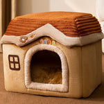 Pet house with a brown roof and beige body on a neutral background