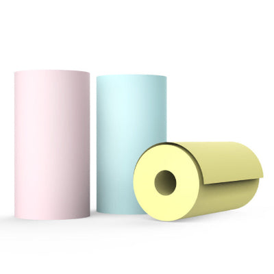 Three cylindrical rolls of paper in pink, blue, and yellow on a white background