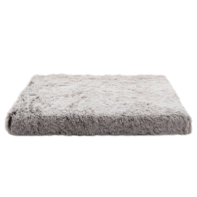 Gray fluffy pet bed on a white background